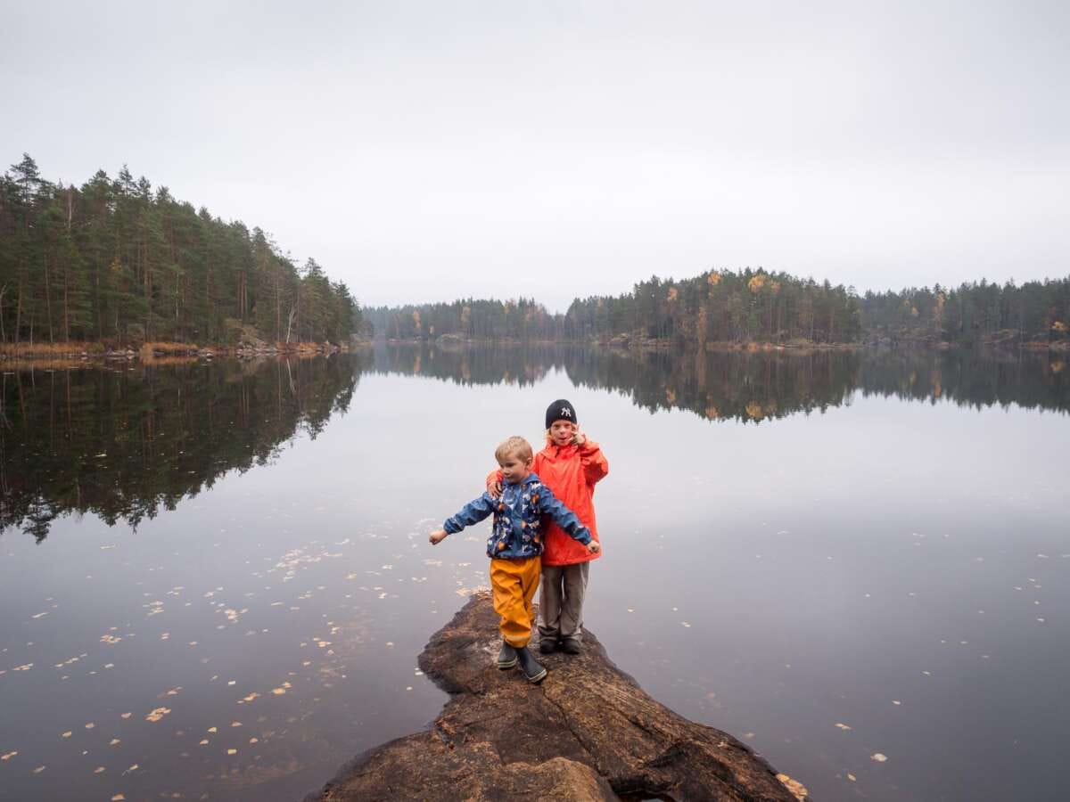 Nuuksio National Park in fall, in October. Hiking and picking mushrooms with children.