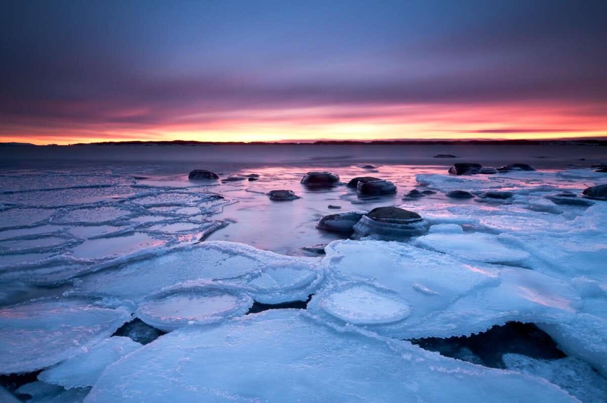 Coast of Baltic Sea around Helsinki in winter, in January. Freezing sea at sunset. Nature near Helsinki, Finland.