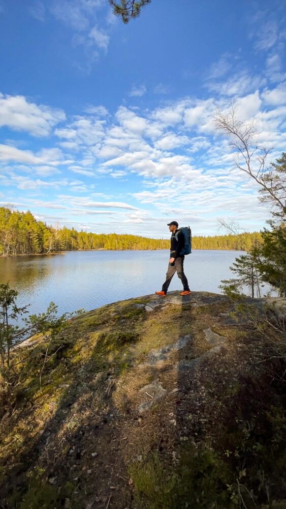 Hiker going around lakes in Nuuksio National Park