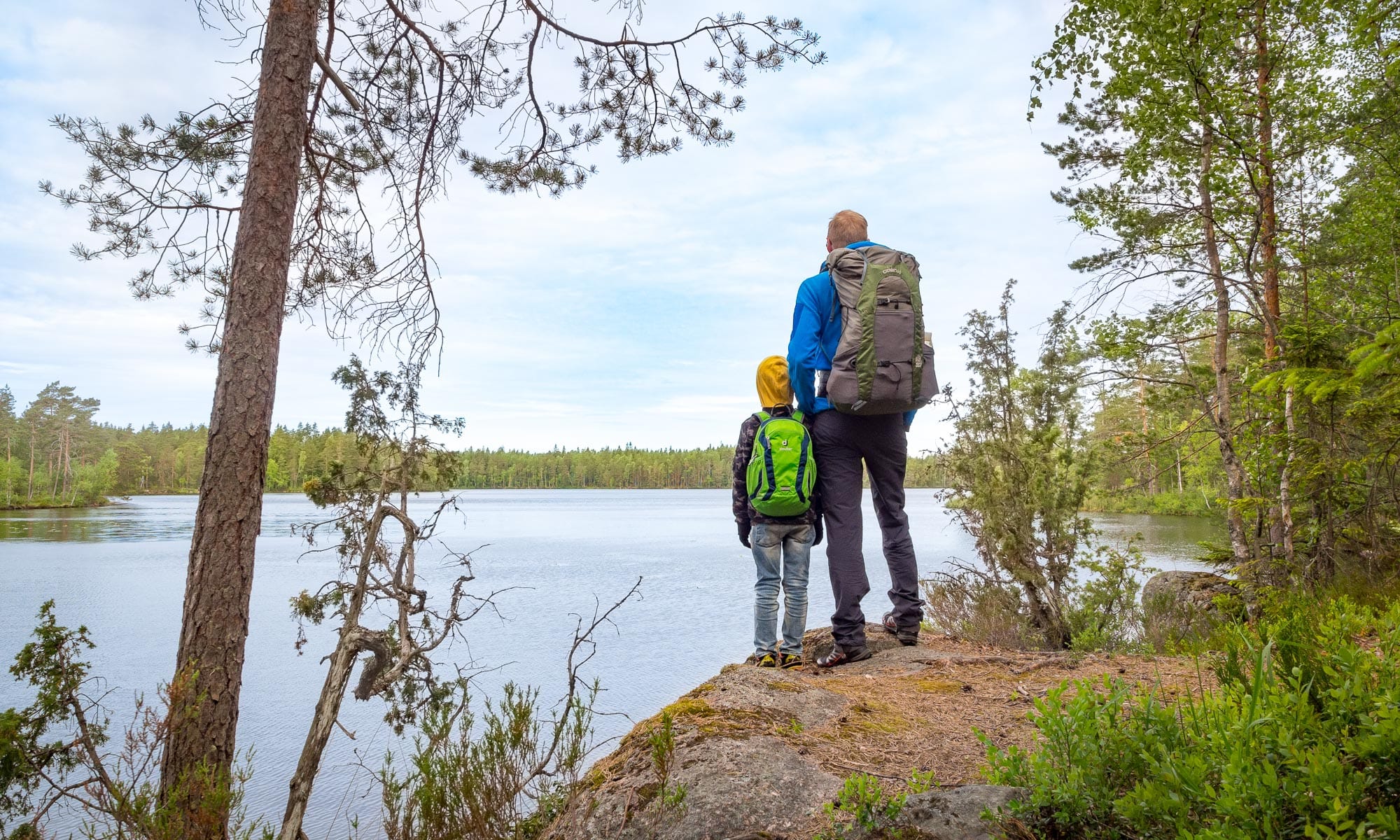 Hikers by a lake in Nuuksio National Park