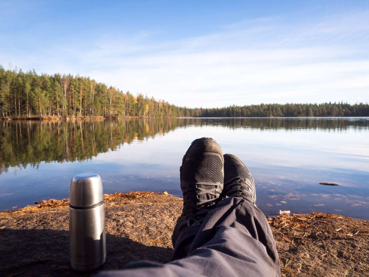 Nuuksio National Park in fall. Having my morning coffee by a beautiful lake. Hiking near Helsinki, Finland.