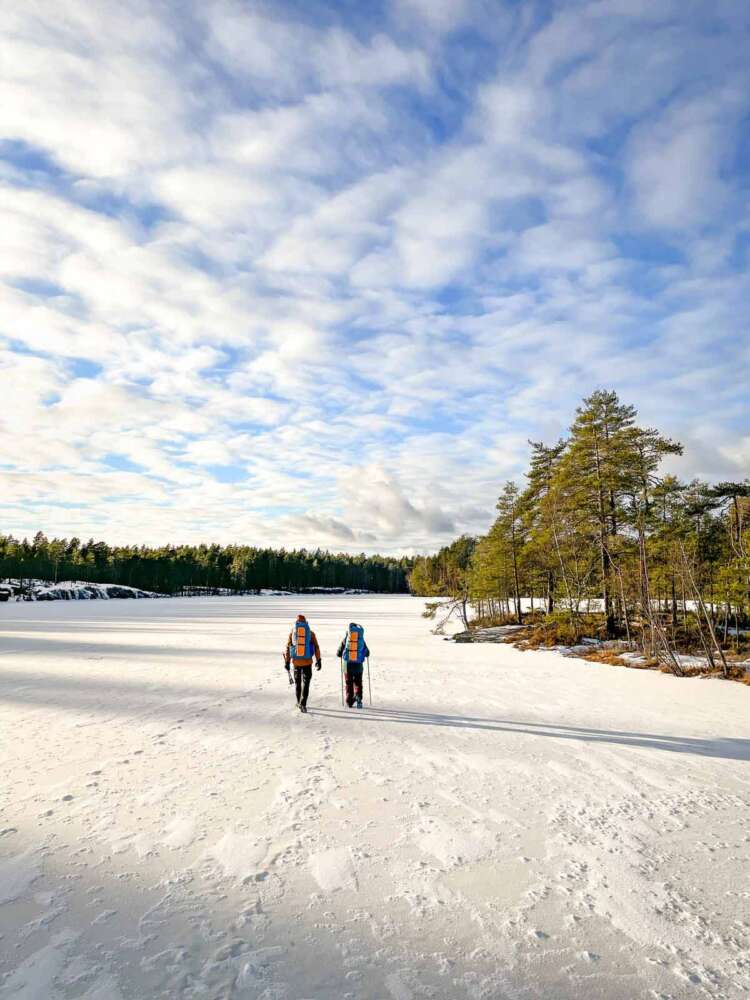 Winter hiking and camping in Nuuksio National Park near Helsinki, Finland.