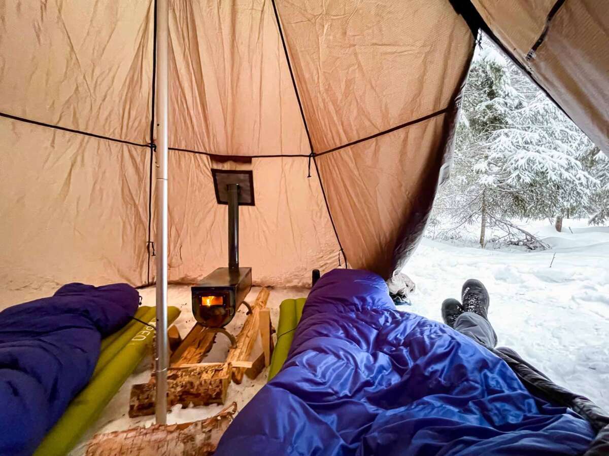 Winter camping in a tent in Finland, Nuuksio National Park near Helsinki.